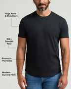 Man wearing a black Pima Cotton Blend Curved Hem Crew 4-Pack shirt, highlighting a modern curved hem, roomy torso, silky smooth feel, and snug fit around arms and shoulders.