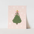 Christmas card with a green tree, pink bow, and snowflakes on a light pink background