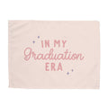Pink blanket with 'In My Graduation Era' text on a white background