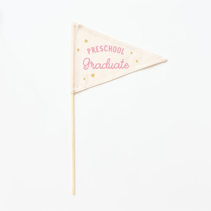 Decorative flag with 'Preschool Graduate' text on a white background