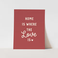 Red poster with white text 'Home is where the love is' on a light gray background