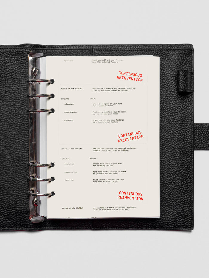 A5 Reinvention Dashboard shown inside a ring-bound planner with a minimal, layered spread.