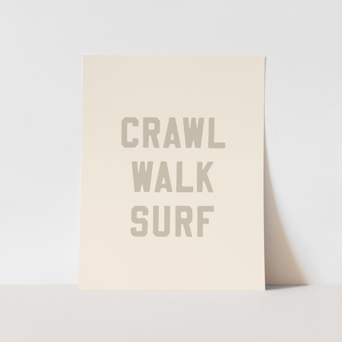 Beige greeting card with 'CRAWL WALK SURF' text on a light gray background