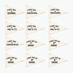 Set of triangle-shaped flags for first day of school celebrations with various grade levels.