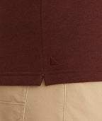 Model is wearing UNTUCKit Snap Fleece Pullover in Brick Red.