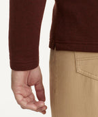 Model is wearing UNTUCKit Snap Fleece Pullover in Brick Red.