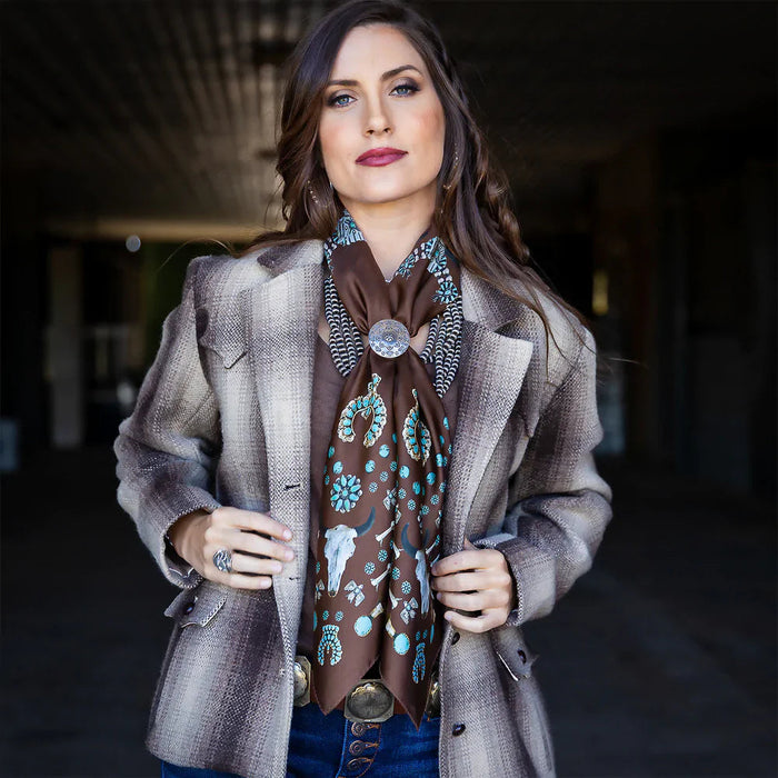 Woman in brown fringe scarf and jacket