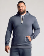 Man wearing Stormy Fleece French Terry Pullover Hoodie.