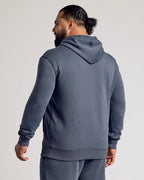 Man in Stormy Fleece French Terry Pullover Hoodie, hood down.