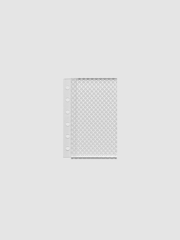 Clear, textured Studded Planner Dashboard in the size Pocket, on a neutral background.