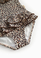 Bathroom wear for children with leopard pattern, narrow straps, and front flap.