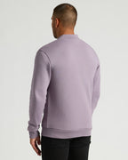 Thistle Fleece Bomber Jacket worn by man, back view.