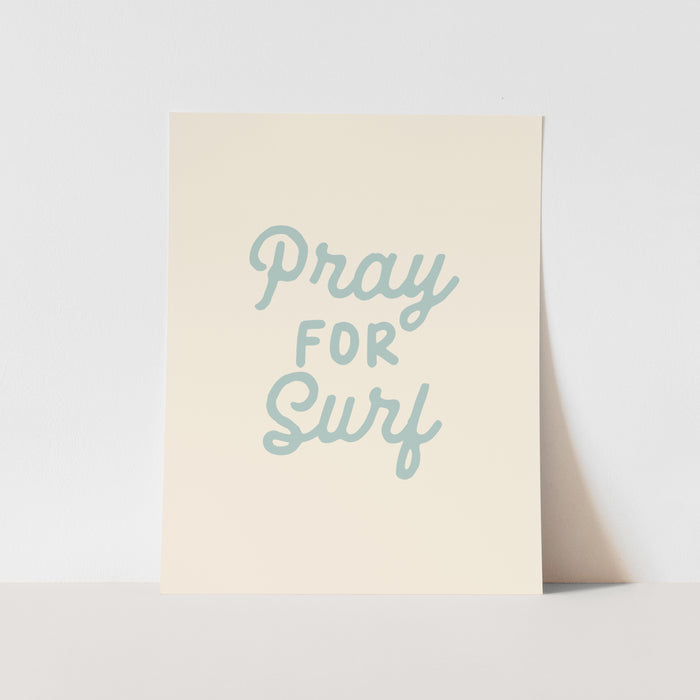 Beige card with 'Pray for Surf' text on a light gray background