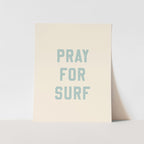 Beige poster with 'PRAY FOR SURF' text on a light gray background