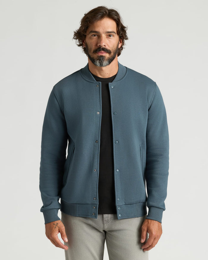 Man wearing Neptune Fleece Bomber Jacket, layered over a T-shirt.