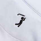 Close-up of the White - Q-Zip’s fabric shows a neat black stitched golfer silhouette, underscoring its golfing theme. The athletic fit and precise embroidery highlight the garment’s stylish texture and quality.