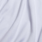 Close-up of the White - Q-Zip's smooth fabric with flowing folds and soft shadows. Its silky texture suggests athletic-fit comfort, while gentle curves add elegance to the moisture-wicking surface.